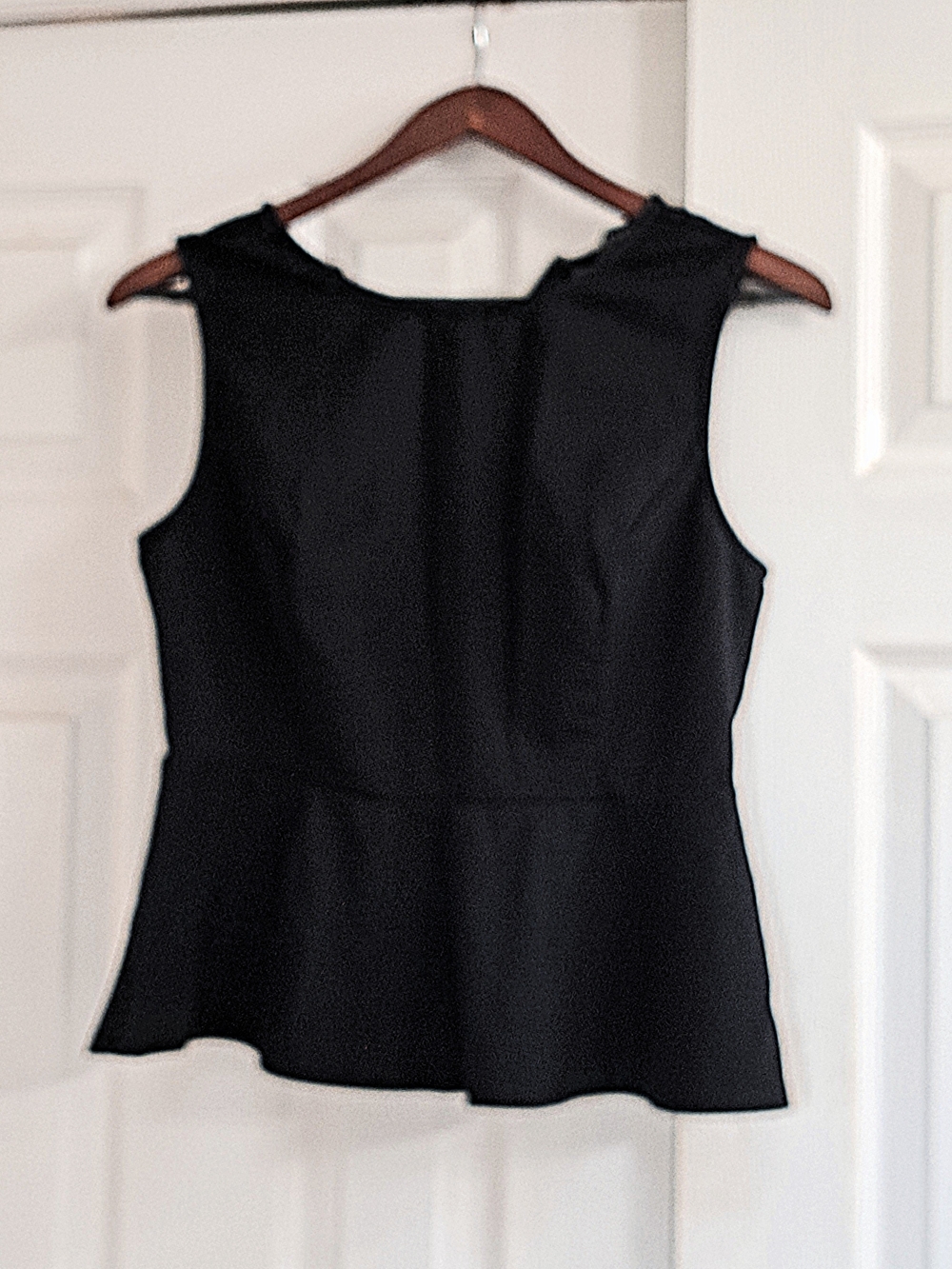 Black Tailored Stretch Sleeveless Top With Sheer Inserts, Flare Ruffle Bottom
